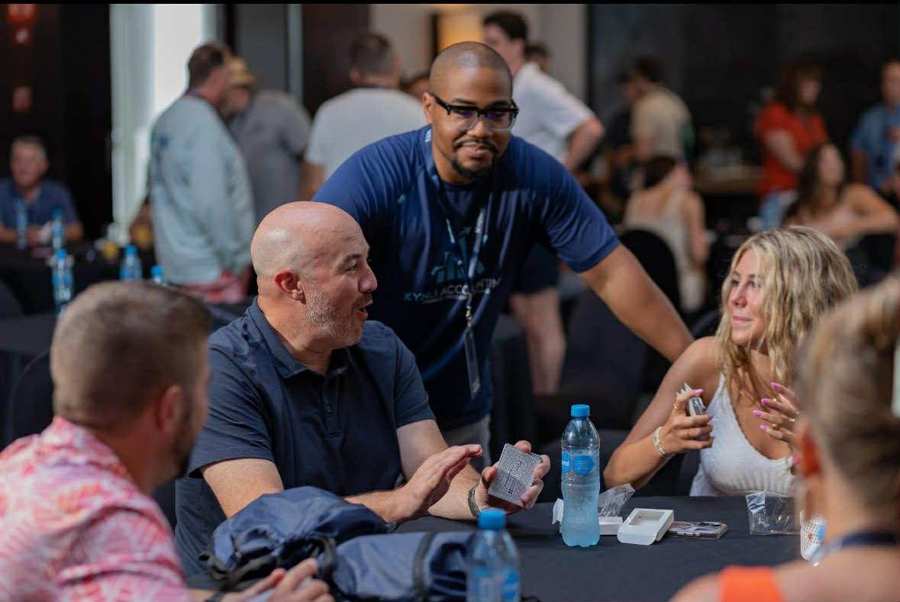 Cameron with agency owners in a working conversation